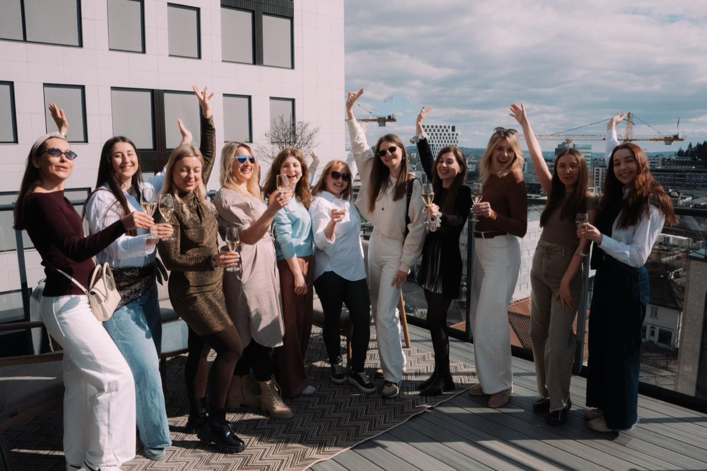 Group celebrating with hands raised